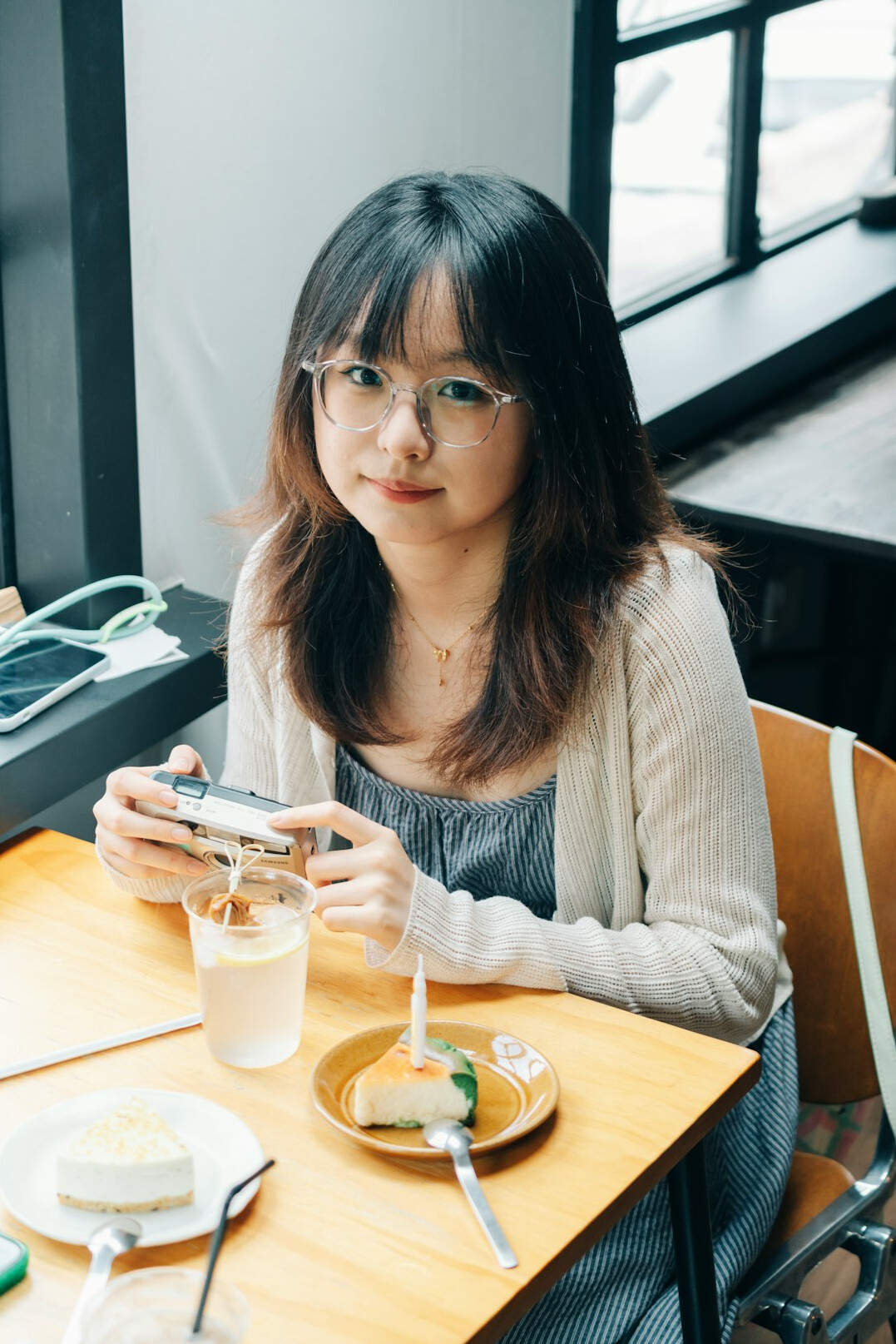 Portrait of a Japanese female software engineer smiling at her desk